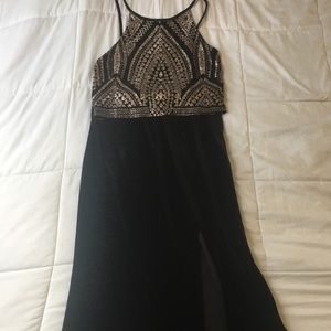 Black and gold prom dress with slit